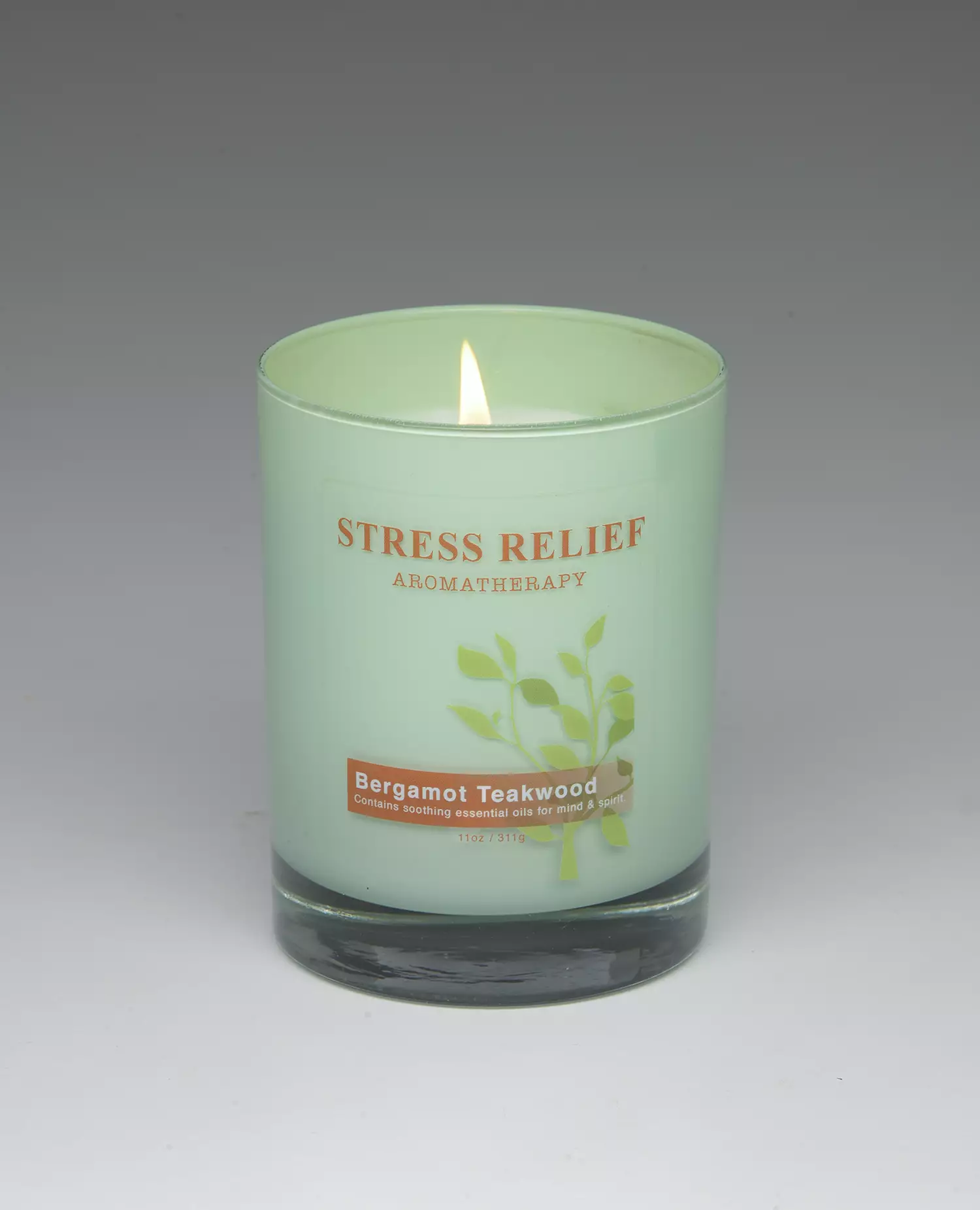 Bergamot Teakwood – 11oz scented candle burning