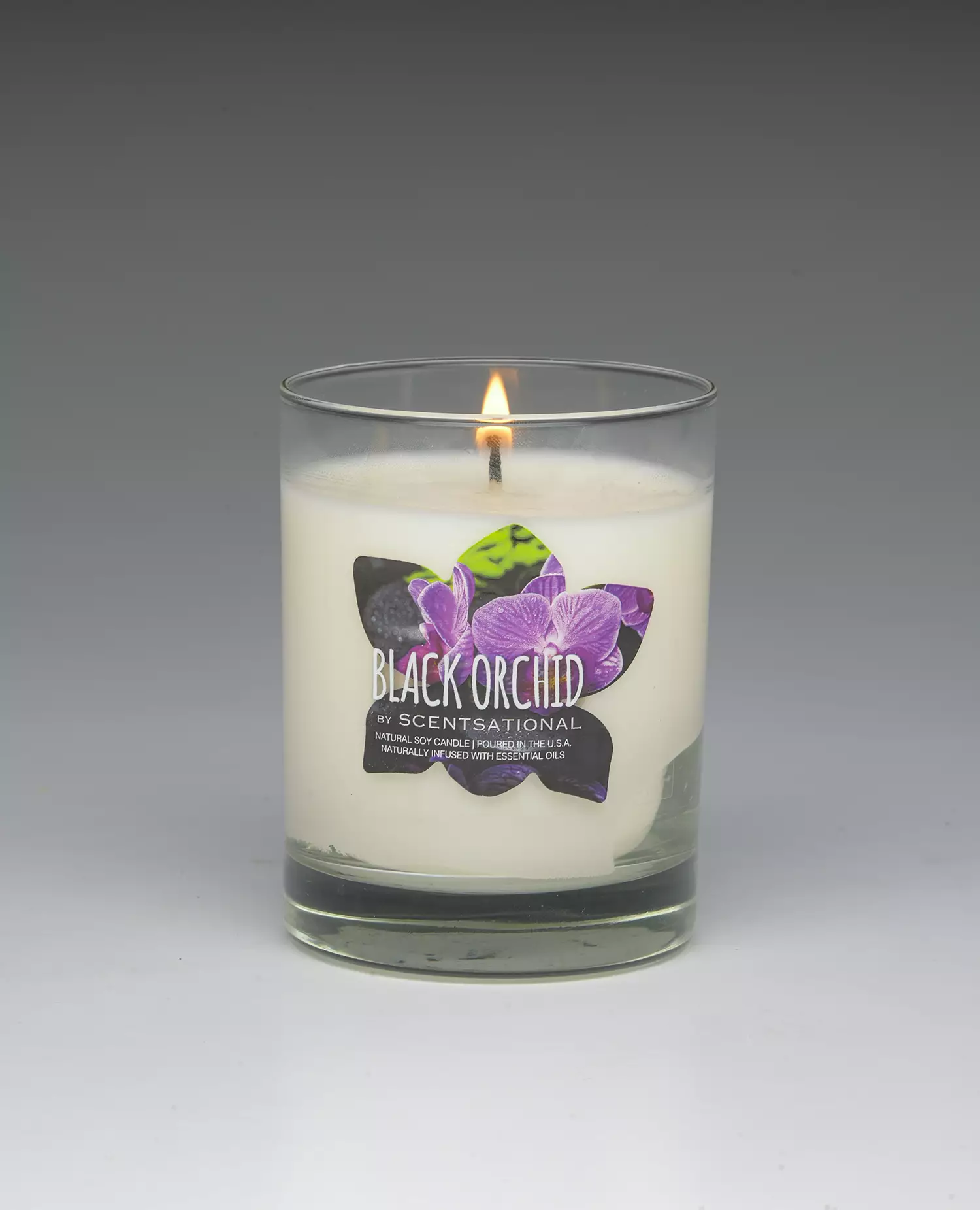 Black Orchid – 11oz scented candle burning