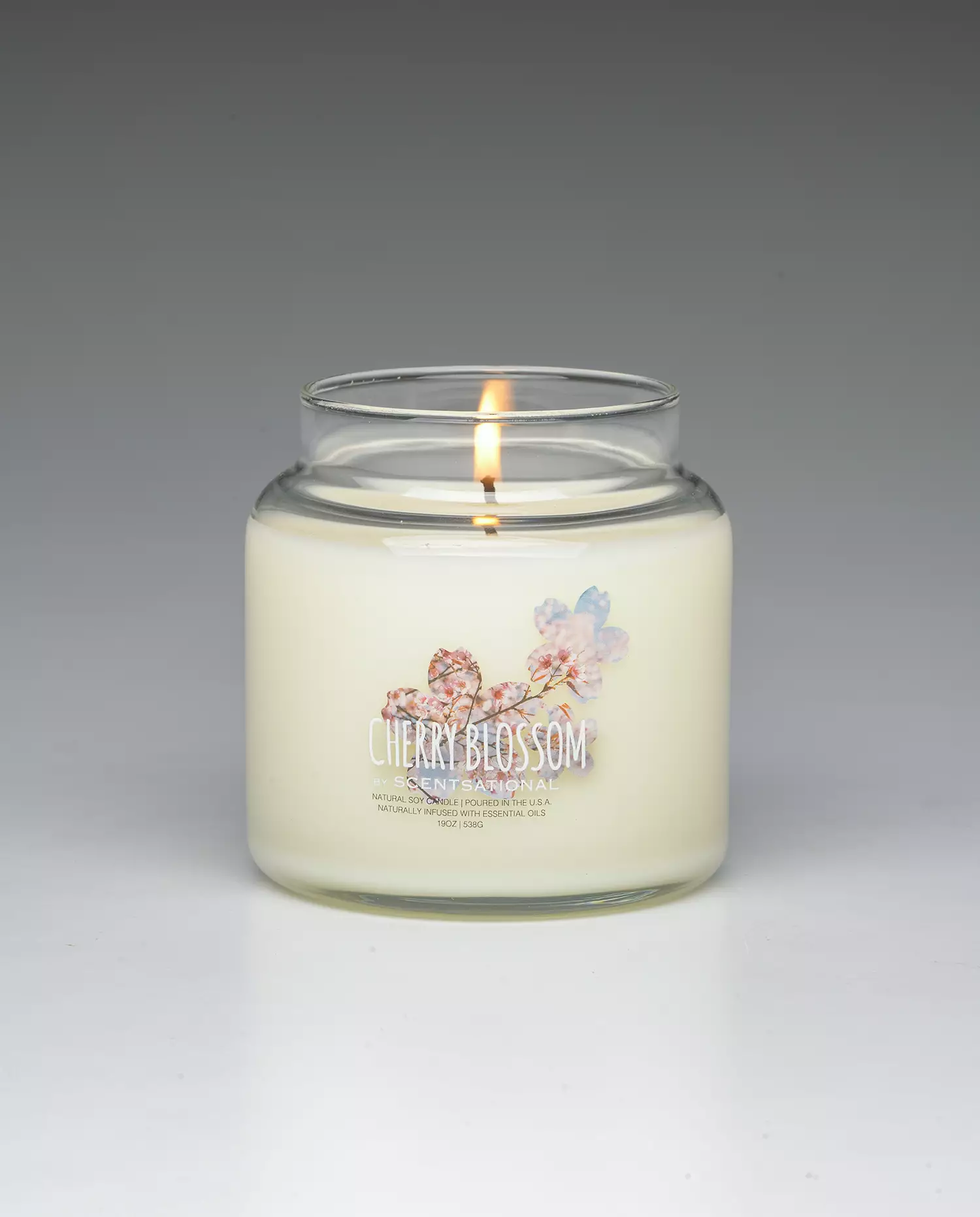 Cherry Blossom 19oz scented candle burning