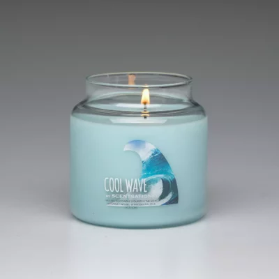 Cool Wave 19oz scented candle burning