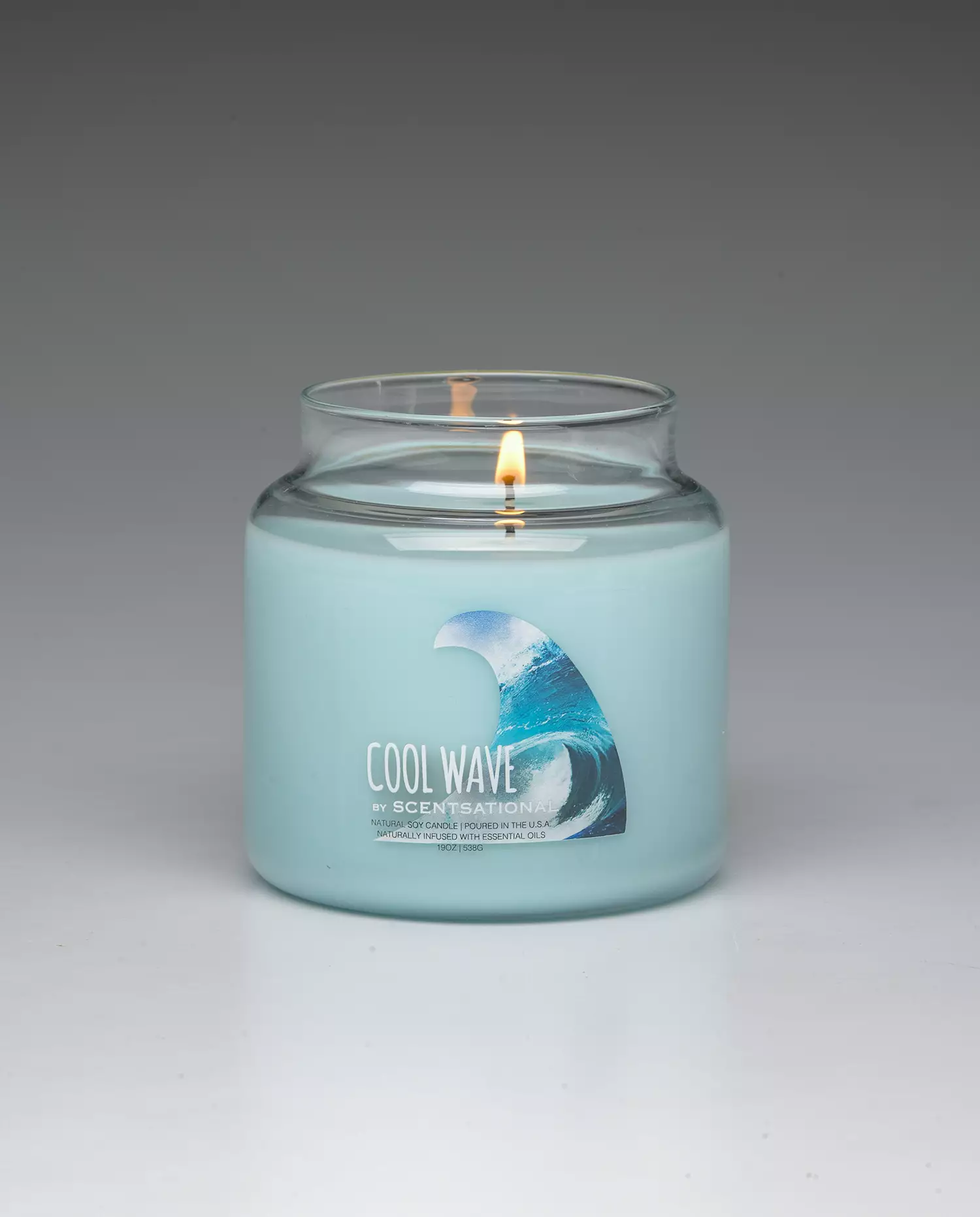 Cool Wave 19oz scented candle burning
