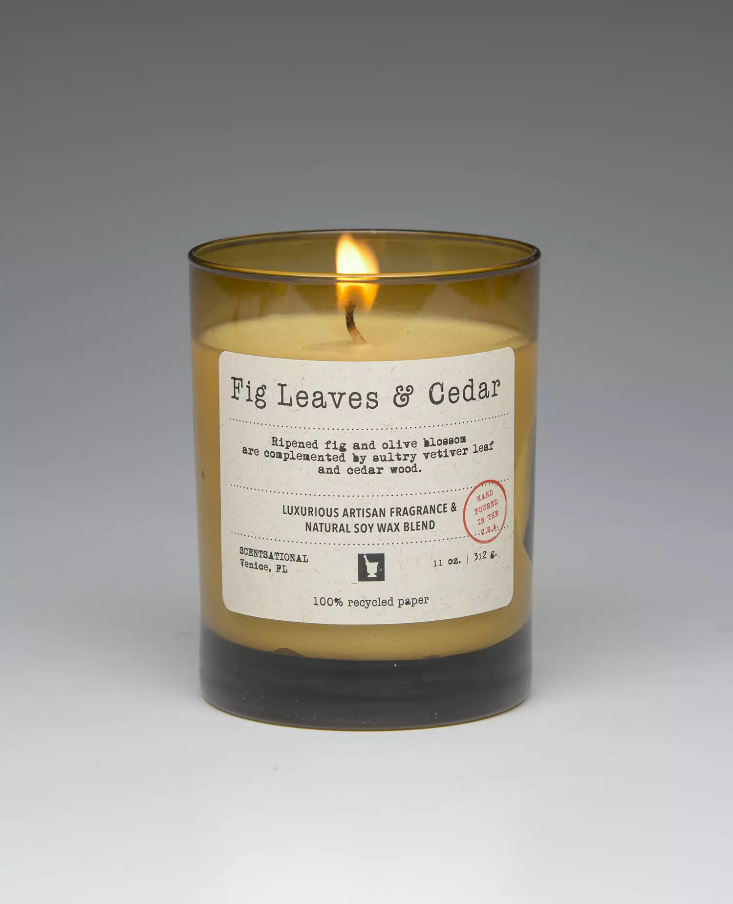 Fig Leaves & Cedar – 11oz scented candle burning