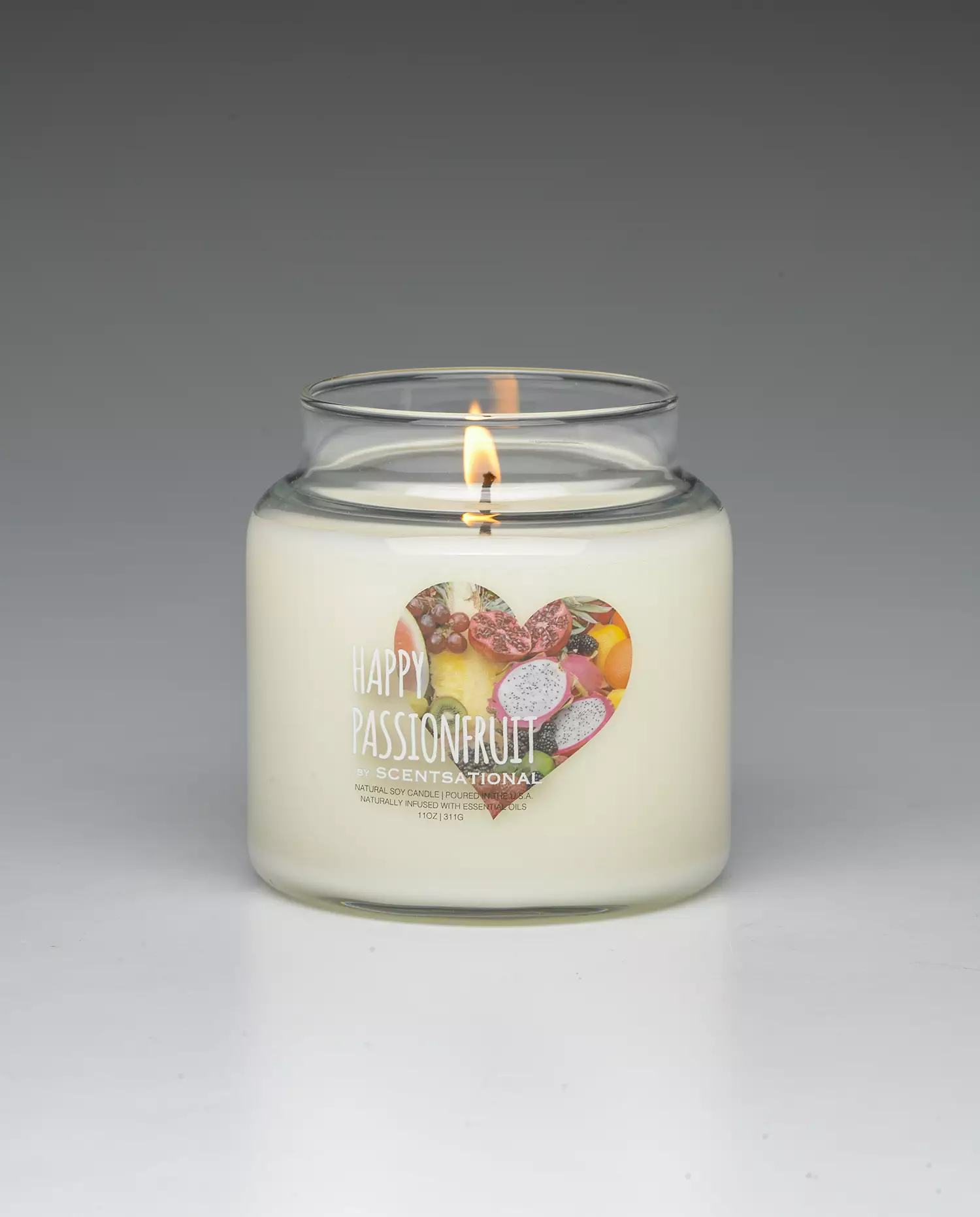 Happy Passionfruit 19oz scented candle burning