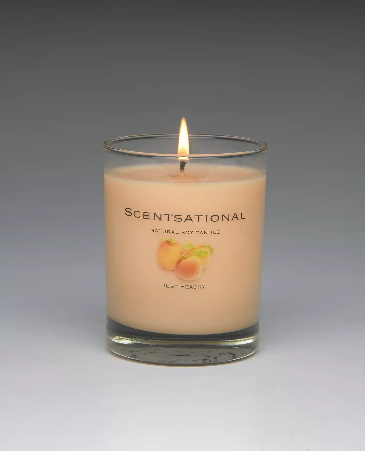 Just Peachy – 11oz scented candle burning