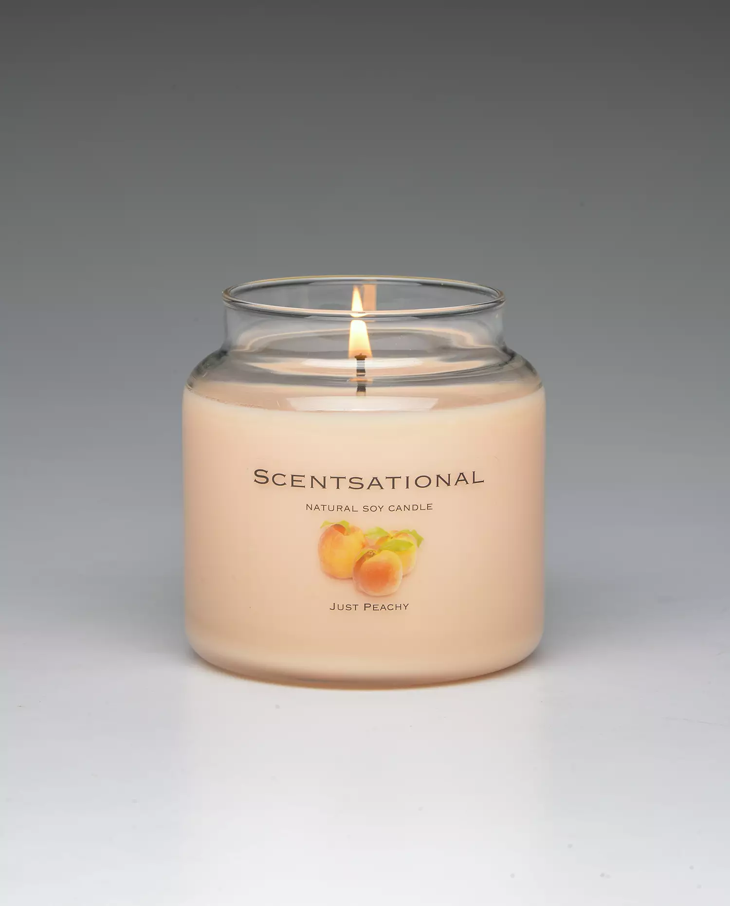 Just Peachy 19oz scented candle burning