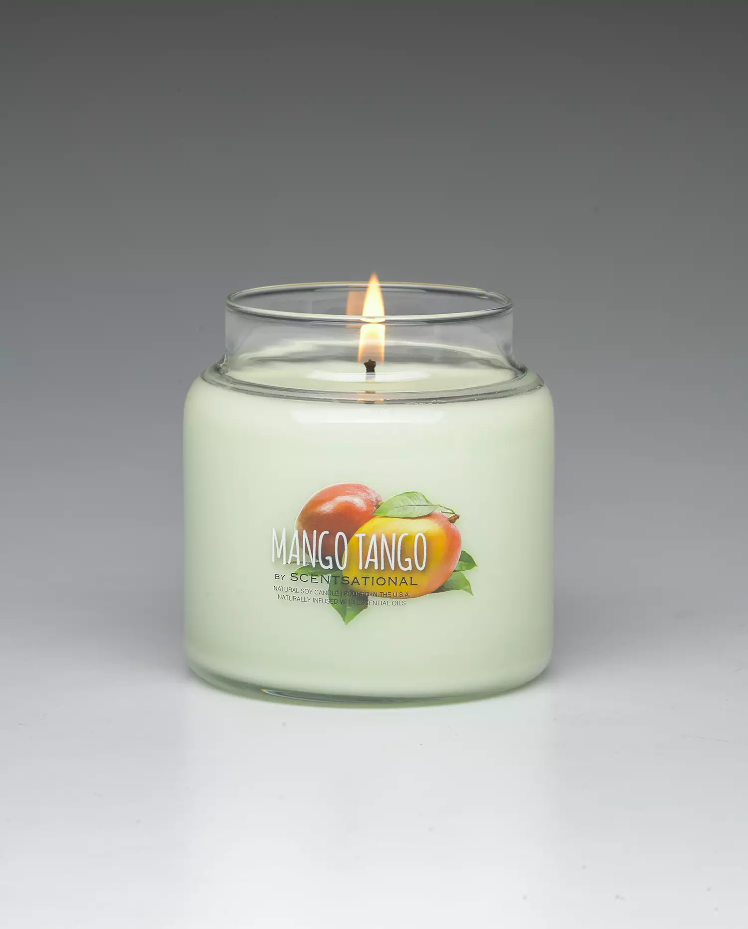 Mango Tango 19oz scented candle burning