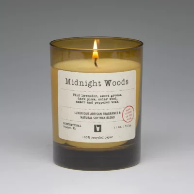 Midnight Woods – 11oz scented candle burning