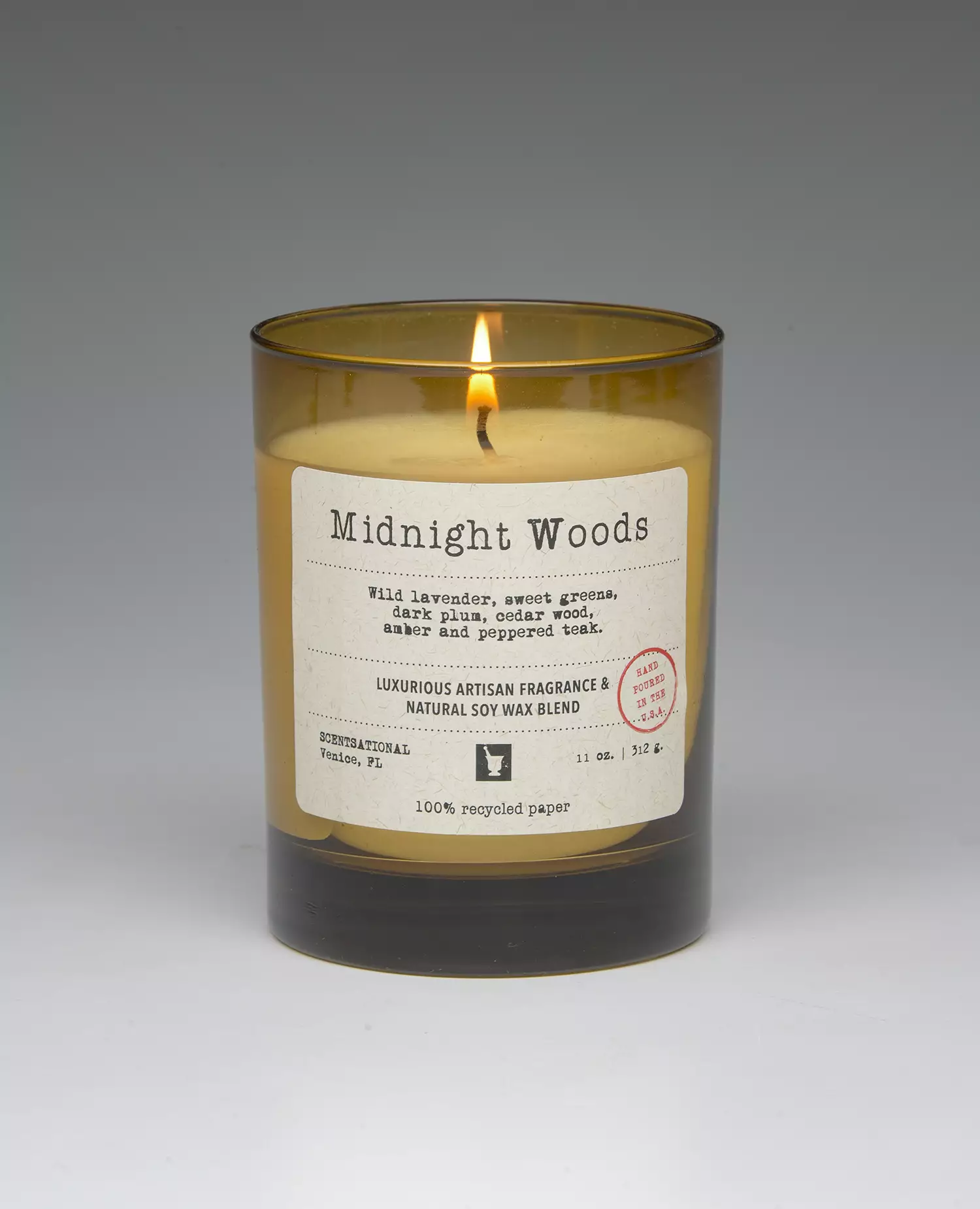Midnight Woods – 11oz scented candle burning