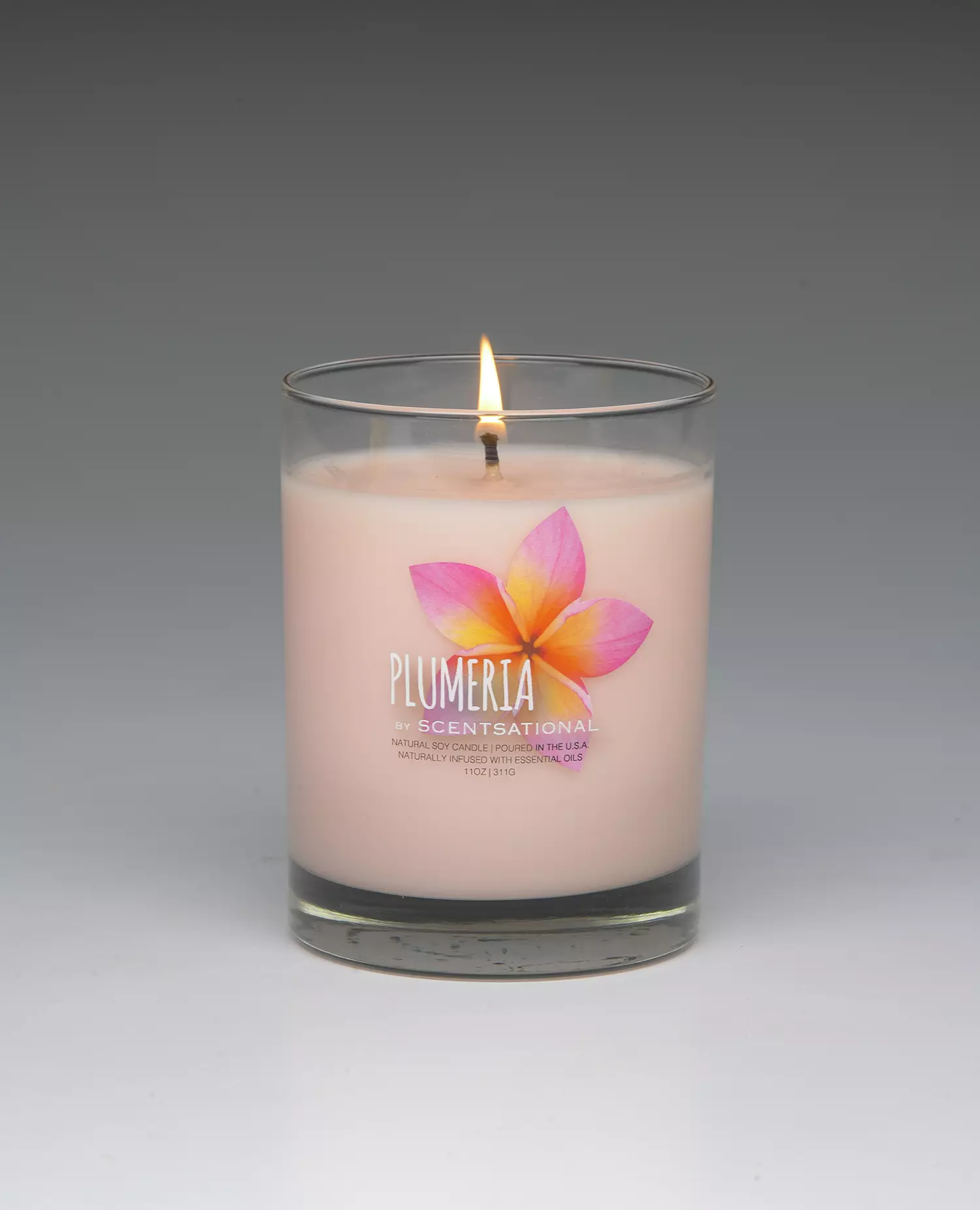 Plumeria – 11oz scented candle burning