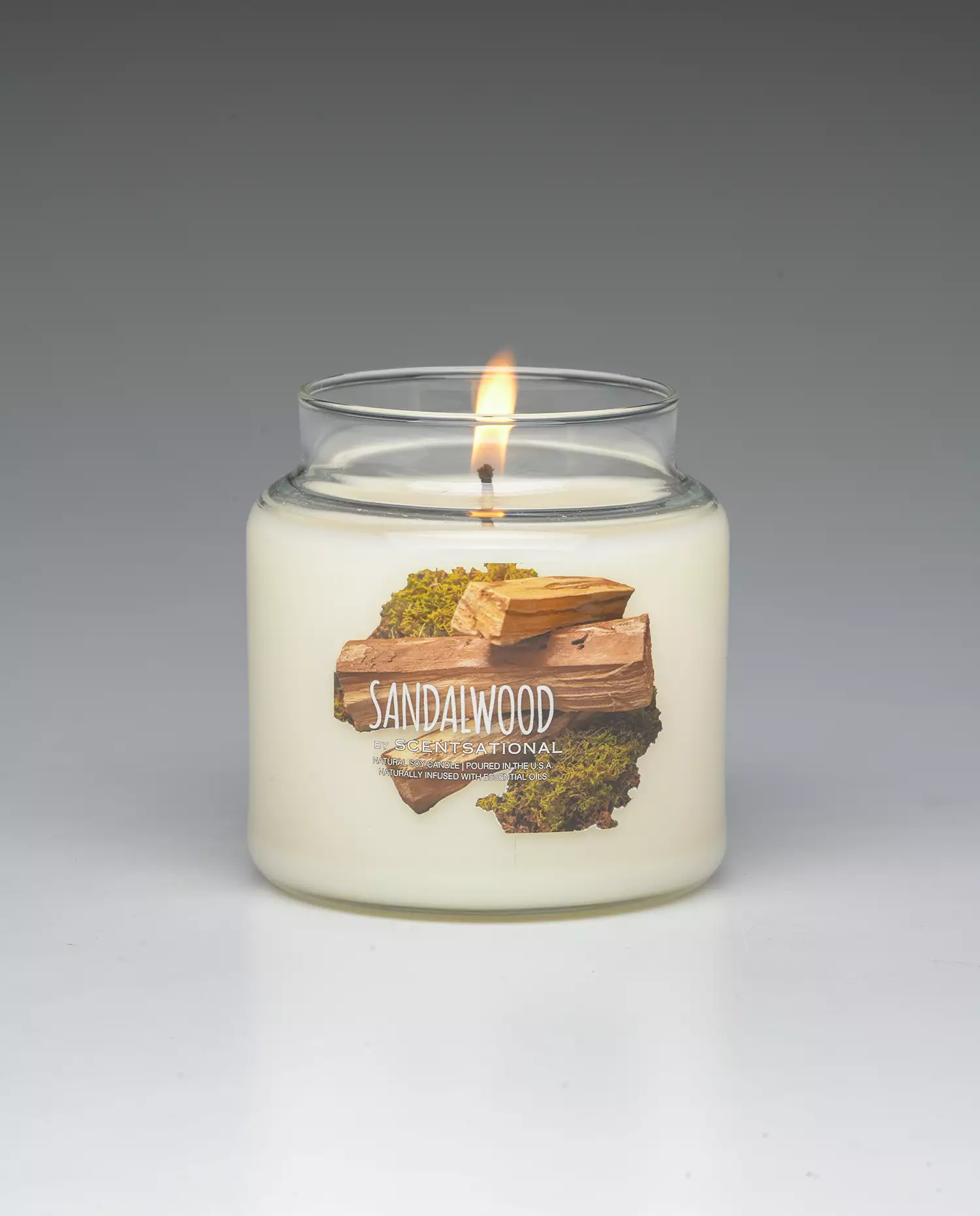 Sandalwood 19oz scented candle burning