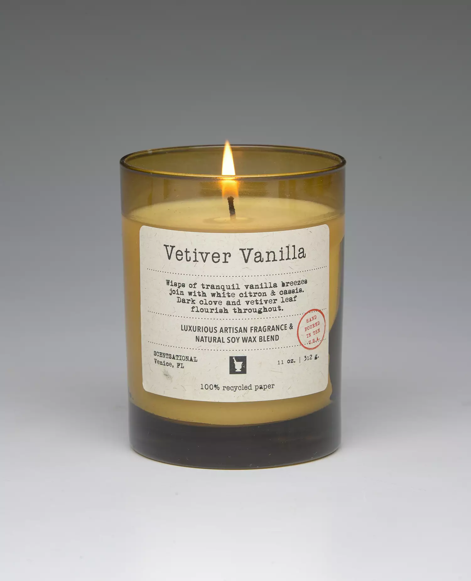 Vetiver Vanilla – 11oz scented candle burning